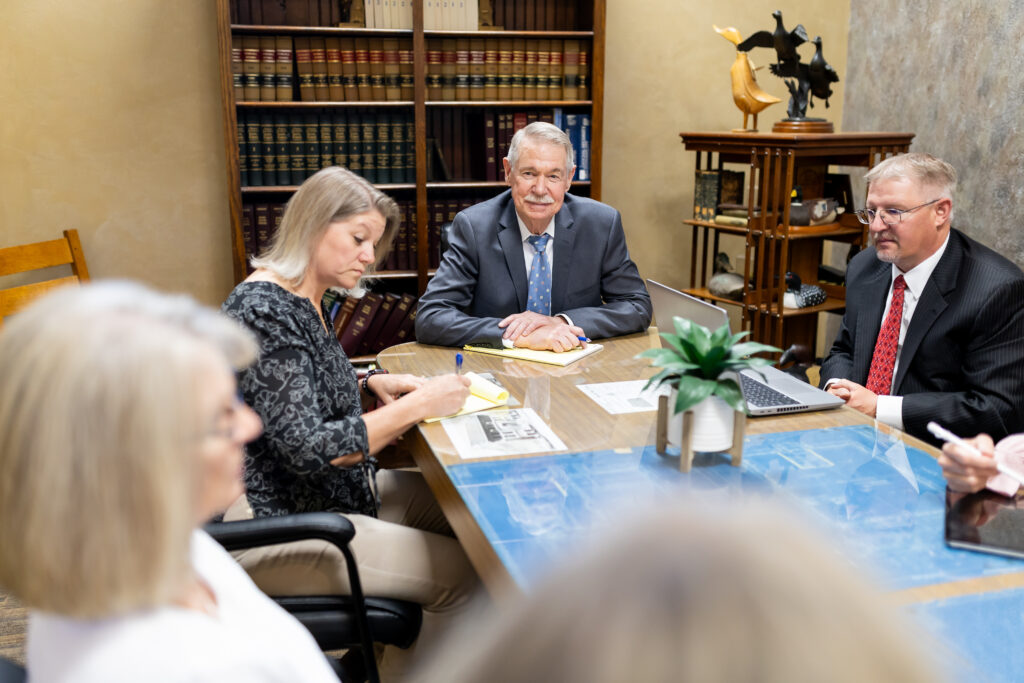 Attorney, William V. Steffens, with associates at Office