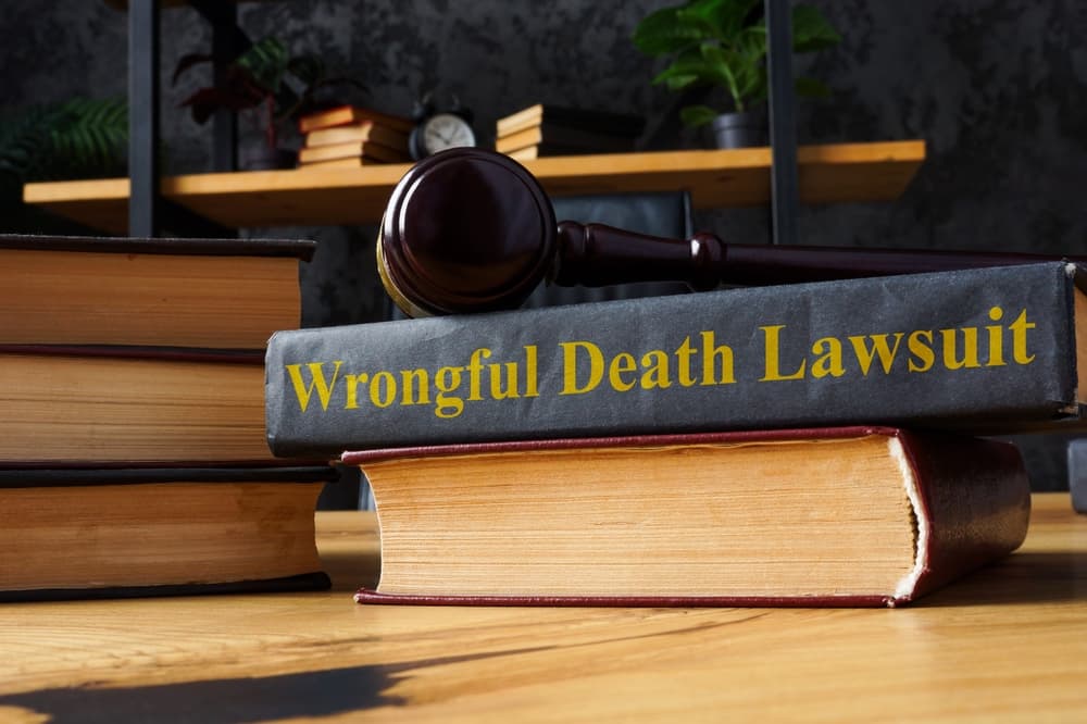 Pile of books  along with Wrongful death lawsuit book