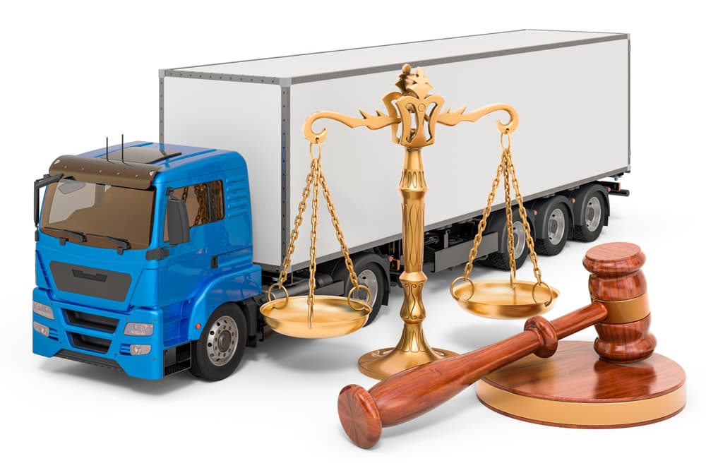 A 3D rendering of a truck placed next to a large wooden gavel and scales of justice, symbolizing legal and insurance support for transport and freight issues. 